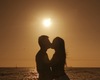 Romantic sunset kiss