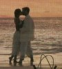 a romantic kiss on the beach.