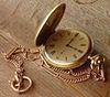 gold strap pocket watch